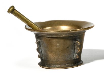 Bronze mortar and pestle with four serrated...
