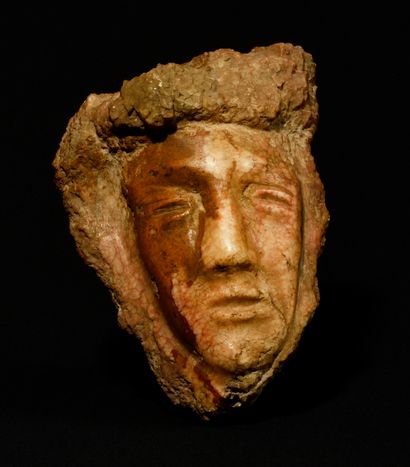 FACE in carved polychrome stone. Old work....