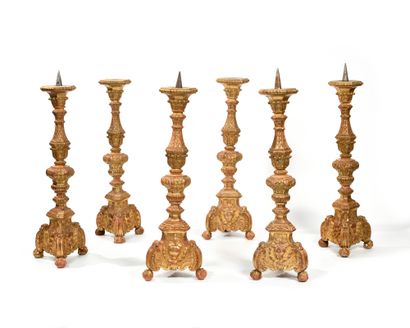  RARE SUITE OF SIX CIERGES of baluster and tripod form in richly carved and gilded...