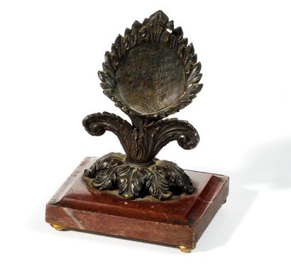 null Bronze WATCH HOLDER decorated with acanthus leaves. Rests on a red veined marble...