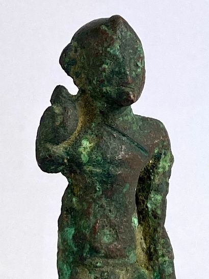 null Statuette of Harpocrates seated Bronze with green patina. Wear. Right arm missing....