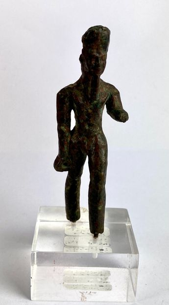  Statuette of Amun walking Bronze, accidents and missing parts Egypt or Nubia, Third...