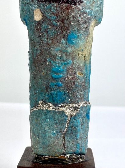 null Oushebti carrying the painted farming instruments Turquoise blue and black earthenware....