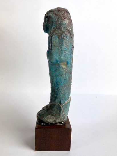  Oushebti carrying the painted farming instruments Turquoise blue and black earthenware....