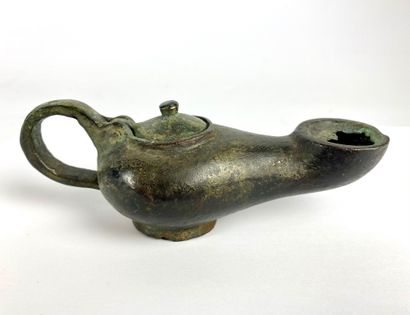 Oil lamp with circular spout and movable...
