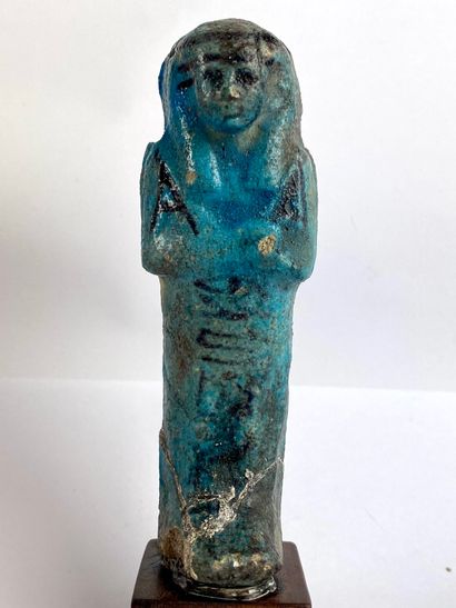  Oushebti carrying the painted farming instruments Turquoise blue and black earthenware....