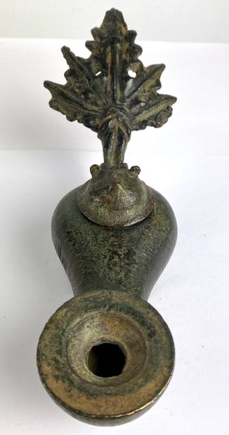 null Oil lamp with a mobile lid in the shape of a lion's head and a reflector in...