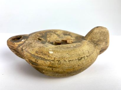 null Oil lamp with heart-shaped spout and medallion decorated with busts of Isis...
