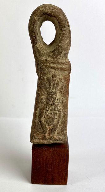 Fragment decorated with a god Bes standing...