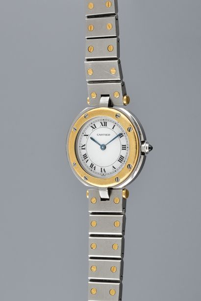 null CARTIER Santos Round. N°S191312474. Circa 2000. Gold and steel wristwatch, signed...