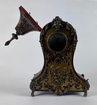 null A cartel shaped clock holder in Boulle marquetry of tortoiseshell and brass....