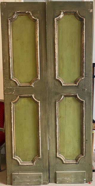 null PAIR OF DOORS in green relacquered wood, carved with polychrome decoration of...