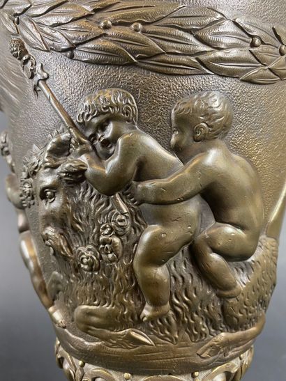 null AFTER CLODION Bronze baluster vase with repoussé decoration of putti and small...
