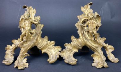  A gilt bronze and patinated fireplace mantelpiece decorated with cherubs on rocailles....