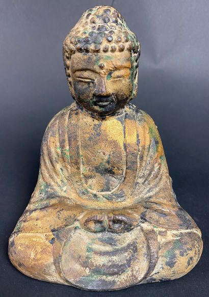 CHINA Cast iron Buddha with traces of gilding....