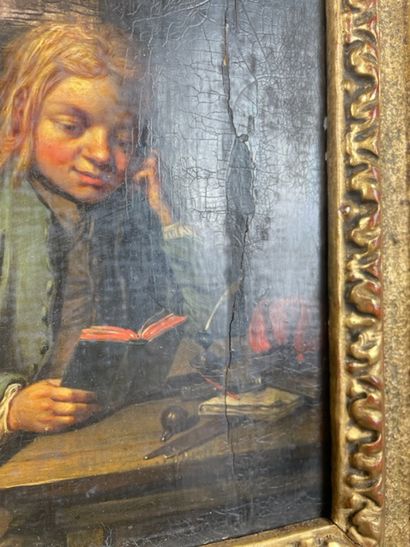 null GERMAN SCHOOL of the XVIIth century Young boy reading Oil on panel (crack) Original...
