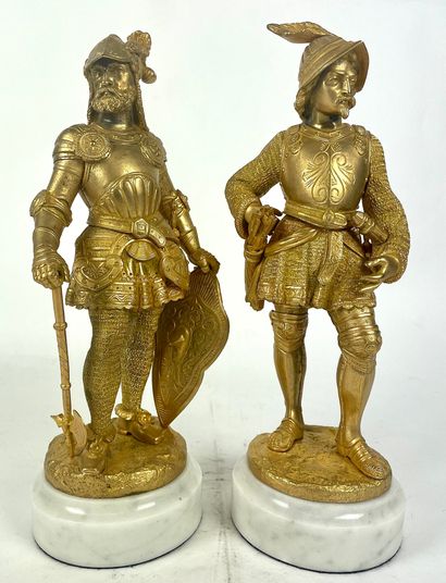  FRENCH SCHOOL of the XIXth century Men in armor Pair of gilded bronzes on white...