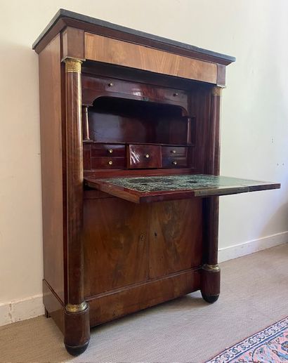 null SECRETARY in mahogany veneer, the posts with detached columns with gilt bronze...