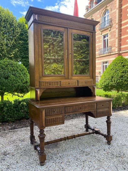 null BUREAU-BLIOTHEQUE in walnut opening with five drawers in the waist carved decoration...