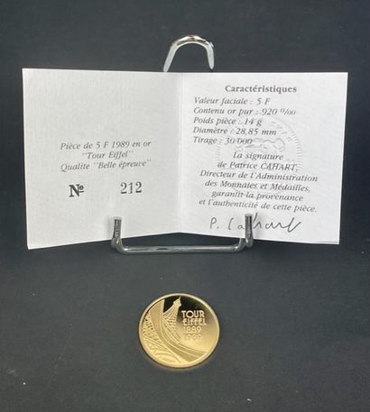 null MONNAIE DE PARIS Commemorative coin 5 francs gold 920 Tour Eiffel. 1989. Case...