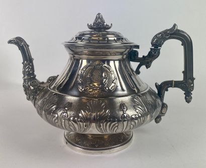 null Silver teapot, sugar bowl and milk jug, chased and embossed with foliage, the...