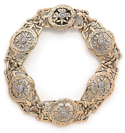 null 
BRACELET 

composed of a succession of links with a plant decoration decorated...