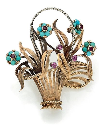null BRACKET adorned with a basket holding flowers punctuated with turquoise (missing...