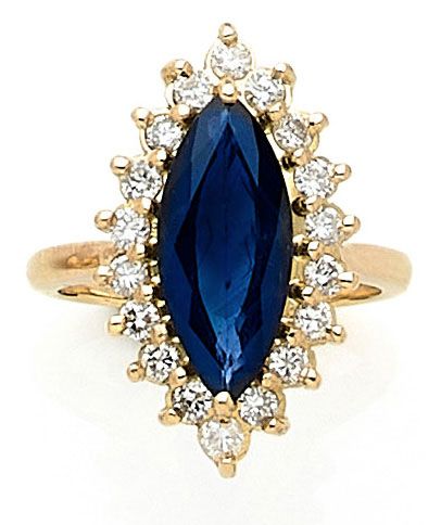 null MARQUISE RING holding a navette sapphire of approximately 2.50 carats in a setting...