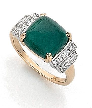 null RING holding a 4.70 carat sugarloaf emerald set with two lines of brilliant-cut...