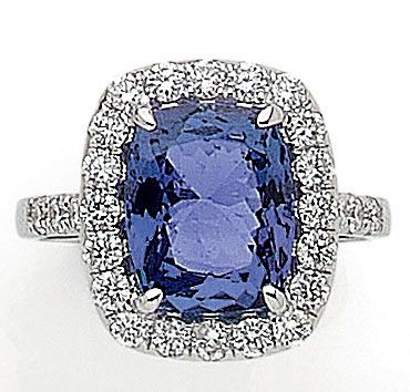 null RING composed of a cushion tanzanite of 4.84 carats in a surround of brilliant-cut...