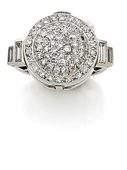 null RING holding a watch adorned with a clapper paved with 8/8 diamonds. The ring...