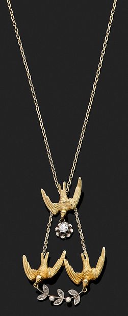 null NECKLACE adorned with a pendant with three swallows holding an old-cut diamond...