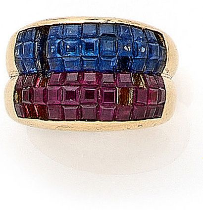 null RING holding two gadroons paved with rubies and sapphires (important lacks)....