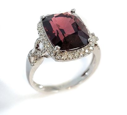 null RING holding a 7.45 carat cushion spinel in a brilliant-cut diamond setting....