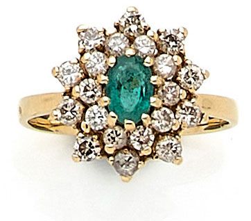 RING holding an emerald of approximately...