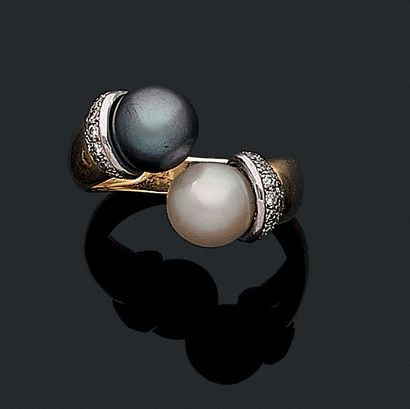 null TOI & MOI RING holding two pearls (not tested), one white and one gray, held...