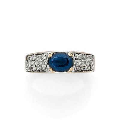 RING holding an oval sapphire of approximately...