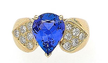 RING holding a pear-shaped tanzanite weighing...