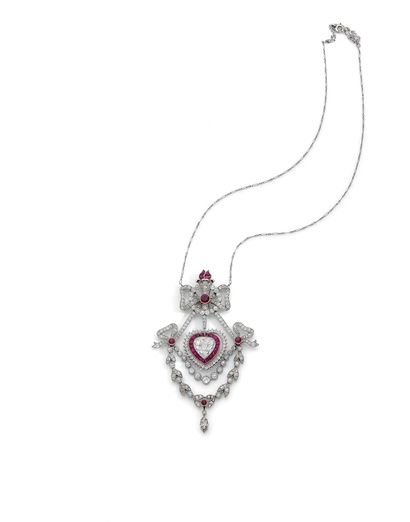 null MAGNIFICENT NECKLACE adorned with a plant design holding in its center a heart...