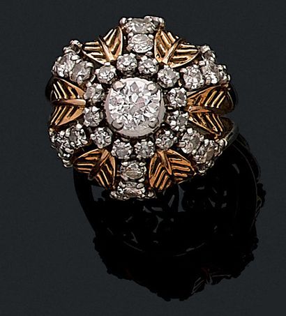 null 1950's RING adorned with a dome holding a 0.60 carat old cut diamond surrounded...