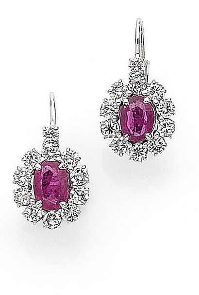 PAIR OF EARRINGS decorated with a flower...