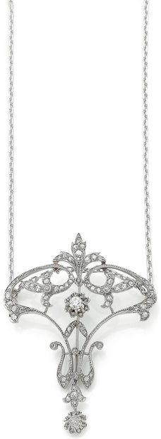 null 
BELLE ÉPOQUE 

PENDENTIF

retenant un décor floral ponctué de diamants taille...