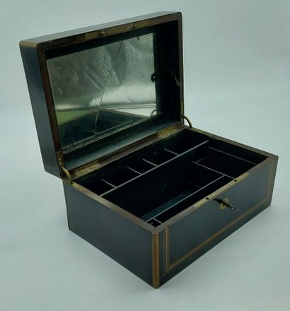 null Wooden box lacquered black and brass, green interior, compartments, 

mark on...