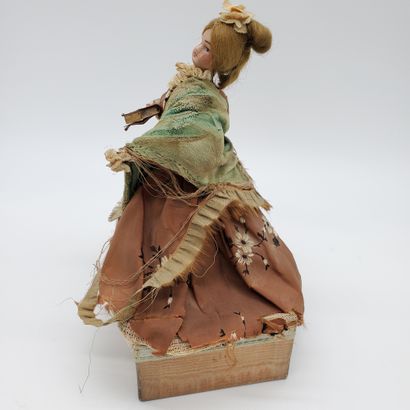 null MUSIC BOX topped by a doll with a porcelain head

Beginning of XXth century...