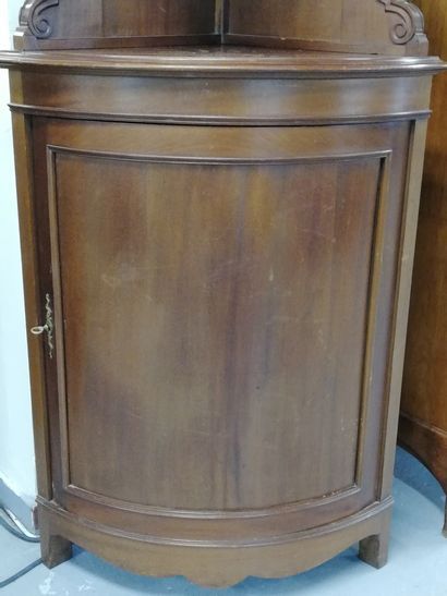 null A two bodies mahogany veneer chest opening by a glass door in the upper part...