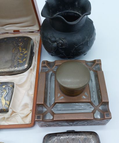 null Lot including a glass inkwell with copper frame, a bronze pocket, a bronze hand...
