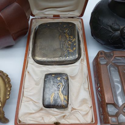 null Lot including a glass inkwell with copper frame, a bronze pocket, a bronze hand...