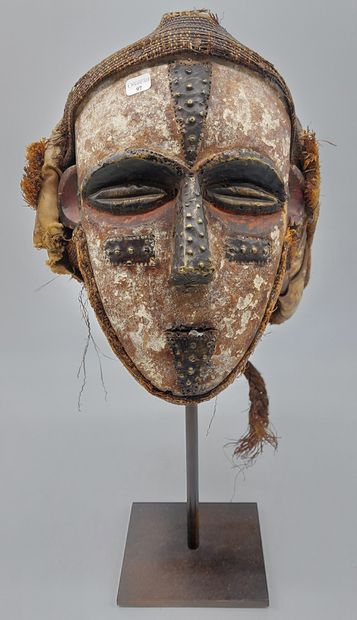 null VOUVI HELMET, Gabon. Carved and painted wood, braided plant fiber, fabric, metal.

L...