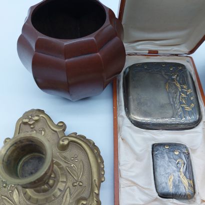 null Lot including a glass inkwell with copper frame, a bronze pocket, a bronze hand...