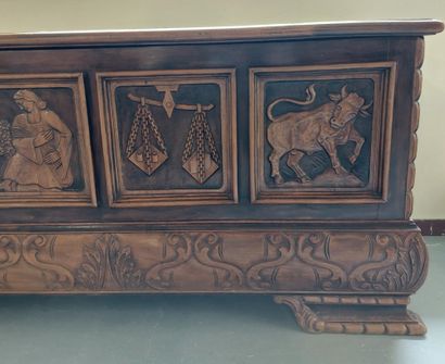 null CHEST in natural wood carved with a goat, a scale, a bull and a woman with a...